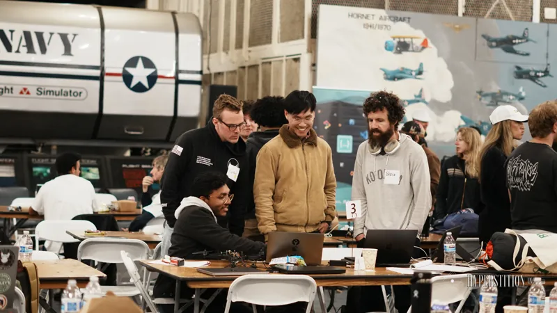 Builders share their work with visitors in the hangar.